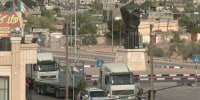 More aid and foreign nationals still waiting to cross border at Rafah