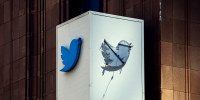 A partially removed sign at the X Twitter headquarters